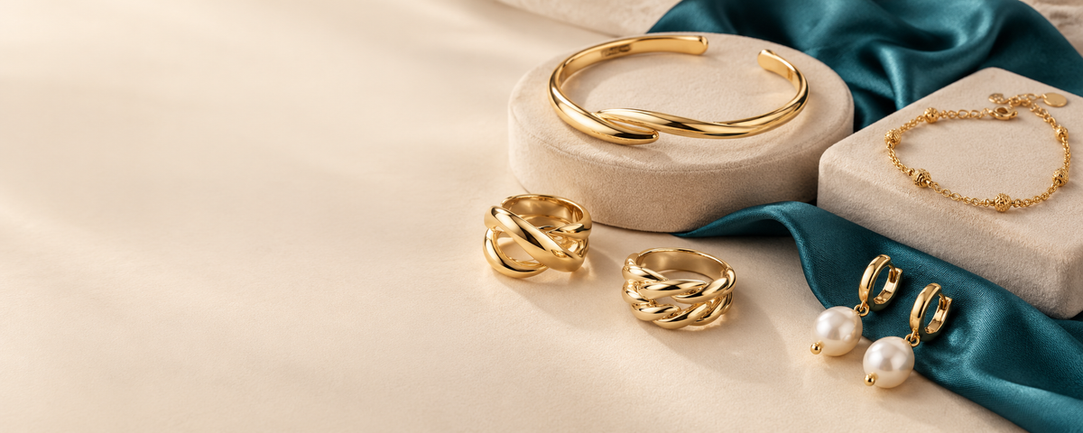 Rings, bracelets and pearl earrings on a velvet display